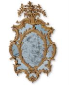 A GEORGE III CARVED GILTWOOD WALL MIRROR, CIRCA 1765