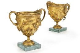 AFTER THE ANTIQUE - A PAIR OF GILT BRONZE CUPS ATTRIBUTED TO CHIURAZZI, LATE 19TH CENTURY