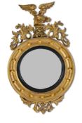 A REGENCY GILTWOOD CONVEX MIRROR, EARLY 19TH CENTURY