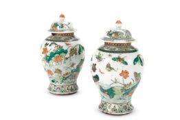 A PAIR OF FAMILLE VERTE PORCELAIN BALUSTER JARS AND COVERS, CHINESE