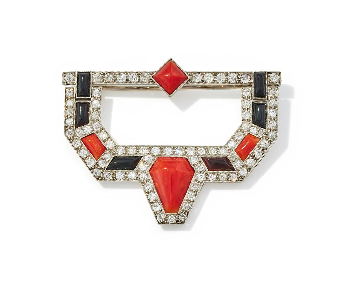 AN ART DECO DIAMOND, CORAL AND ONYX BROOCH