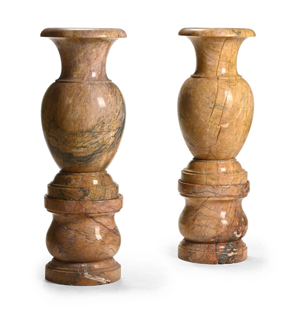 A LARGE PAIR OF MARBLE URNS ON PEDESTALS, MODERN