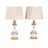 A PAIR OF VICTORIAN GILT METAL MOUNTED ROSE PAINTED CERAMIC LAMP BASES, MID 19TH CENTURY