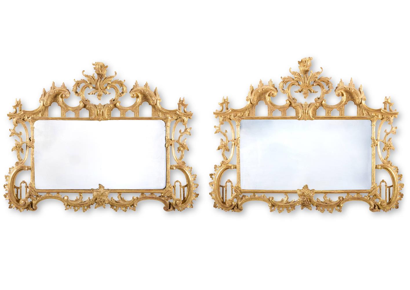 A PAIR OF CARVED GILTWOOD MIRRORS, OF IRISH GEORGE II STYLE, ONE MID 18TH CENTURY