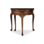 A QUEEN ANNE WALNUT DEMI-LUNE GAMES TABLE, EARLY 18TH CENTURY