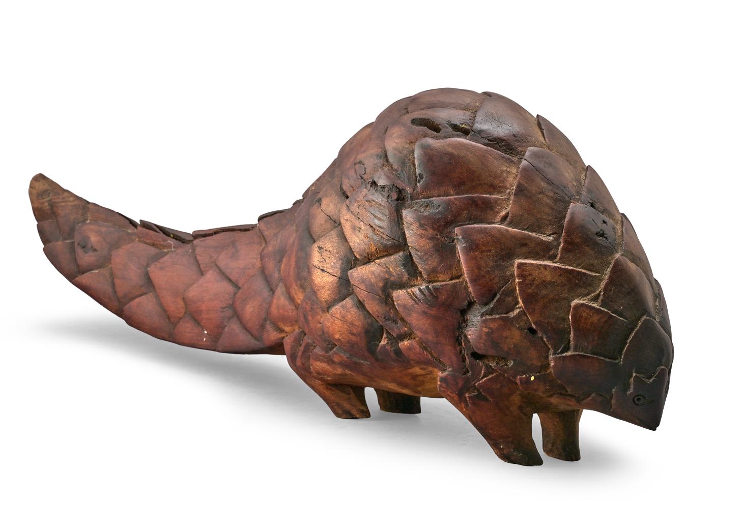 A CARVED HARDWOOD STYLISED MODEL OF A PANGOLIN, LATE 20TH CENTURY