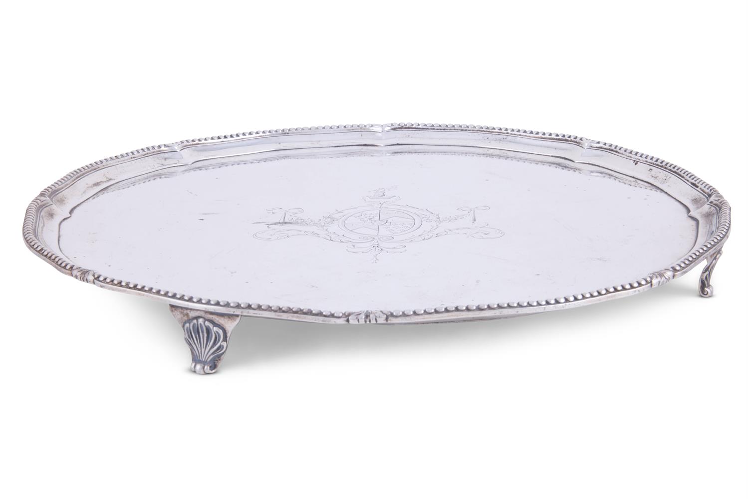 A GEORGE III SILVER SHAPED CIRCULAR SALVER