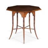 AN OCTAGONAL 'SIX-LEGGED' CENTRE TABLE BY E. W. GODWIN (ENGLISH 1833-1886), CIRCA 1880