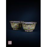 A pair of Chinese yellow ground Canton enamel 'lotus' jardiniers