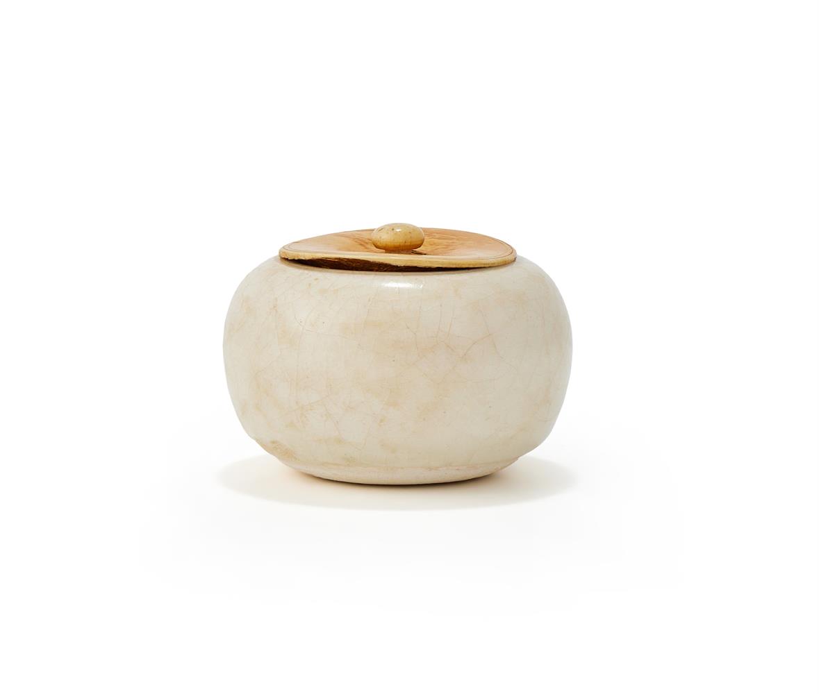 A Chinese high fired white glazed alms bowl