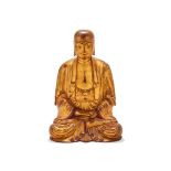 A Chinese gilt and lacqured figure of a seated buddha