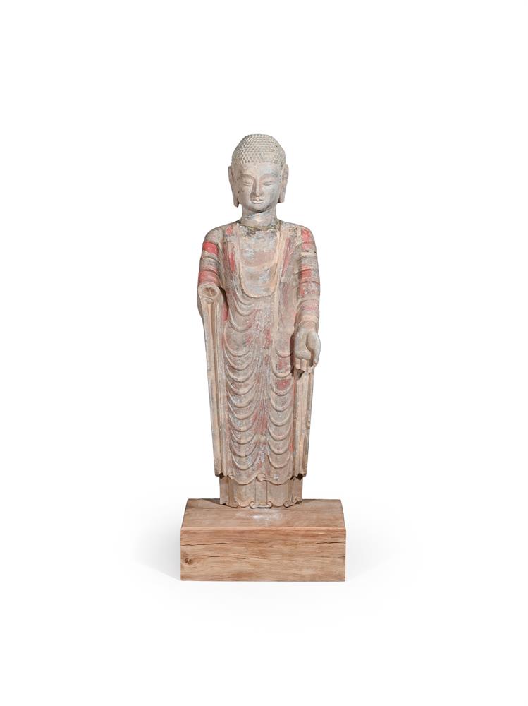 A Chinese painted grey stone figure of buddha