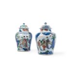 A PAIR OF WUCAI BALUSTER VASES AND COVERS, 17TH CENTURY