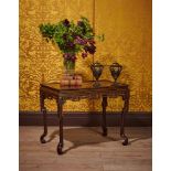 A CHINESE EXPORT BLACK LACQUER AND GILT CHINOISERIE DECORATED CENTRE OR SIDE TABLE