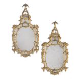 A LARGE PAIR OF CARVED GILTWOOD MIRRORS, IN THE MANNER OF THOMAS CHIPPENDALE, 18TH OR 19TH CENTURY