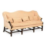 A GEORGE III CARVED MAHOGANY AND UPHOLSTERED SETTEE, IN THE MANNER OF THOMAS CHIPPENDALE, CIRCA 1770