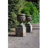 A PAIR OF CARVED SANDSTONE URN PLANTERS, EARLY 19TH CENTURY