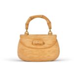GUCCI, AN UNUSUAL GILT METAL MOUNTED SOLID CARVED WOOD DISPLAY '1947' HANDBAG