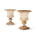 A LARGE PAIR OF CAST IRON GARDEN URNS