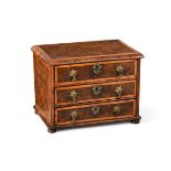 A QUEEN ANNE MINIATURE OLIVEWOOD OYSTER, WALNUT AND HOLLY BANDED CHEST OF DRAWERS, CIRCA 1710