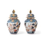 A PAIR OF JAPANESE IMARI VASES AND COVERS, 19TH CENTURY