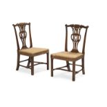 A PAIR OF GEORGE III MAHOGANY SIDE CHAIRS, IN THE MANNER OF THOMAS CHIPPENDALE, CIRCA 1770