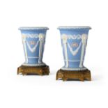 A PAIR OF WEDGWOOD PALE BLUE JASPER AND GILT BRONZE MOUNTED VASES, DATE STAMPED 1867