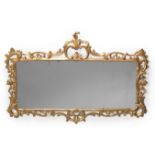 A GEORGE III CARVED GILTWOOD MIRROR, CIRCA 1770