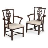 A PAIR OF GEORGE III CARVED MAHOGANY ARMCHAIRS, IN THE MANNER OF THOMAS CHIPPENDALE, CIRCA 1760