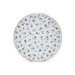 A SÈVRES PORCELAIN PLATE WITH AN OZIER-MOULDED BORDER, CIRCA 1783