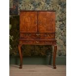 A GEORGE I FIGURED WALNUT AND CROSSBANDED CHEST ON STAND, CIRCA 1720