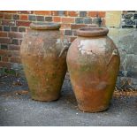 A PAIR OF ITALIAN TERRACOTTA OIL JARS, BY CARLO BITOSSI MONTELUPO, EARLY 20TH CENTURY
