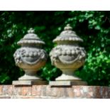 A PAIR OF COMPOSITION STONE FRUIT FINIAL VASES, BY AUSTIN AND SEELEY, CIRCA 1860-1880