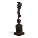 A REGENCY/EMPIRE BRONZE CANDLESTICK À LA VICTOIRE, EARLY 19TH CENTURY, IN THE MANNER OF THOMIRE DUTE