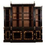 Y A REGENCY GILT-BRASS MOUNTED AND INLAID EBONY AND CALAMANDER BREAKFRONT BOOKCASE