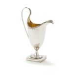 A GEORGE III SILVER HELMET SHAPED CREAM JUG, HESTER BATEMAN, LONDON 1786