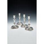 A SET OF FOUR GEORGE I CAST SILVER CANDLESTICKS, SAMUEL MARGAS, LONDON 1724