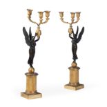 A PAIR OF FRENCH BRONZE AND GILT METAL THREE-LIGHT CANDELABRA, IN EMPIRE STYLE, MID 19TH CENTURY