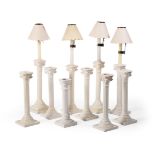 TEN VARIOUS CREAM COLOURED POTTERY COLUMNAR CANDLESTICKS, LATE 19TH CENTURY AND LATER