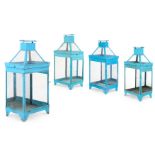 A SET OF FOUR BLUE PAINTED MIRROR BACK TABLE LANTERNS, 20TH CENTURY