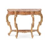 A CONTINENTAL CARVED GILTWOOD AND SIMULATED MARBLE CONSOLE TABLE, EARLY 19TH CENTURY