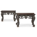 A PAIR OF CARVED WOOD AND EBONISED CONSOLE TABLES, IN THE MANNER OF WILLIAM KENT, CONTEMPORARY