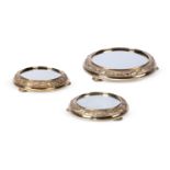 A VICTORIAN SCOTTISH SILVER GILT SUITE OF THREE MIRROR PLATEAUX, GEORGE EDWARD & SONS GLASGOW 1879