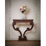 A GEORGE II CARVED MAHOGANY CONSOLE TABLE, IN THE MANNER OF WILLIAM JONES, CIRCA 1755