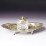 Edwardian silver navette shape inkstand with silver mounted glass inkwell