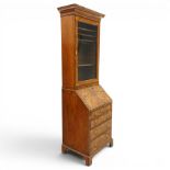Quality George I figured and burr walnut bureau-cabinet of unusually small proportions