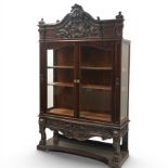 Large and impressive 19th century heavily carved mahogany display cabinet