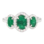 Platinum emerald and diamond trilogy ring
