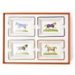 Hermès - set of four miniature porcelain ashtrays