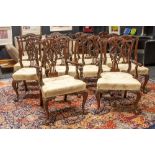 nice English Chippendale style set of twelve chairs and two armchairs in finely carved mahogany